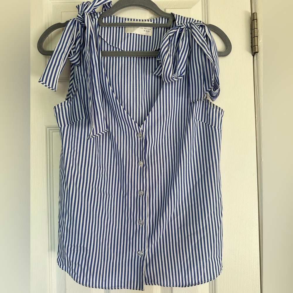 Sleeveless summer low cut button down blouse
